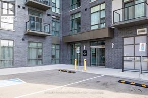 Hamilton (Waterdown) condo for rent - A building with the sign RE/MAX Escarpment Realty Inc. Prokofiev in front of it.