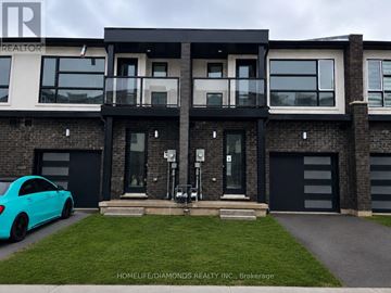 Welland (Lincoln/Crowland) townhouse for rent - A blue car is parked in front of a modern two-story house.