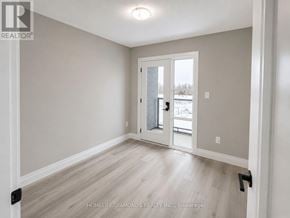 Welland (Lincoln/Crowland) townhouse for rent - A room with a door leading to a snowy landscape.