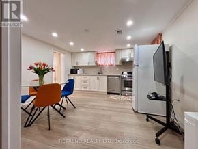 Toronto (Yorkdale-Glen Park) apartment for rent - A kitchen with a dining table and chairs is shown in the image.