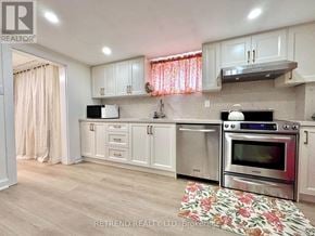 Toronto (Yorkdale-Glen Park) apartment for rent - A kitchen with a stove top oven and a microwave.