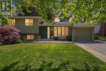 Burlington (Roseland) apartment for rent - A house with a green lawn and a tree in front.
