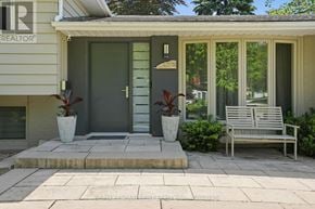 Burlington (Roseland) apartment for rent - A house with a green door and a bench in front of it.
