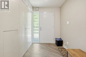 Burlington (Roseland) apartment for rent - A hallway with a white door and a black trash bin.