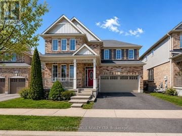 Cambridge apartment for rent - A large house with a red door and a garage.