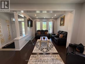 Cambridge apartment for rent - A living room with a glass table and leather couches.