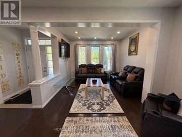 Cambridge apartment for rent - A living room with a glass table and leather couches.