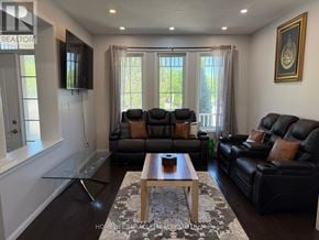 Cambridge apartment for rent - A living room with black leather couches and a wooden coffee table.