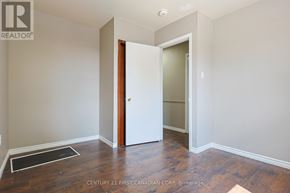 London East (East H) apartment for rent - A room with a wooden floor and a white door.