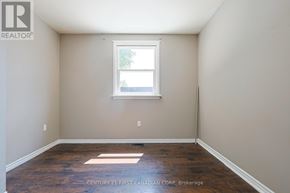 London East (East H) apartment for rent - A room with a window and wooden flooring.
