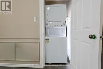 London East (East H) apartment for rent - A white dishwasher is in a small kitchen.