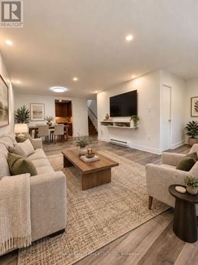 Toronto (Scarborough Village) townhouse for rent - A living room with a couch, a coffee table, and a television.