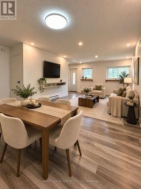 Toronto (Scarborough Village) townhouse for rent - A well-lit, modern living room with a dining area in the foreground.