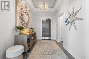 Burlington (Brant) condo for rent - A modern, well-lit hallway with a large star-shaped decoration on the wall.