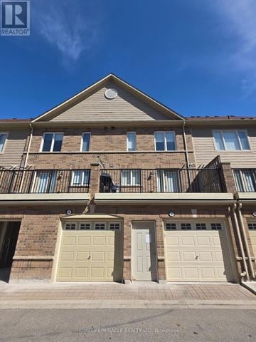Mississauga (Churchill Meadows) house for rent - A two-story residential building with a balcony on the second floor.