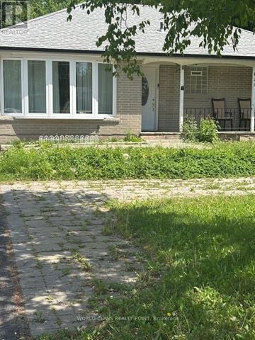 Richmond Hill (Crosby) apartment for rent - A house with a grey roof and a white door.