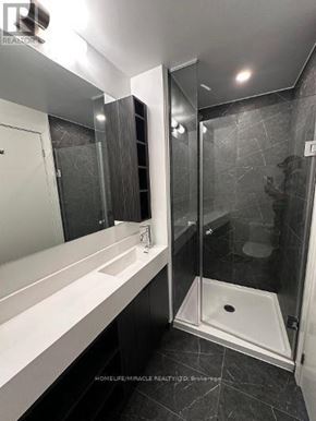 Toronto (Church-Yonge Corridor) condo for rent - A bathroom with a walk-in shower and a sink.