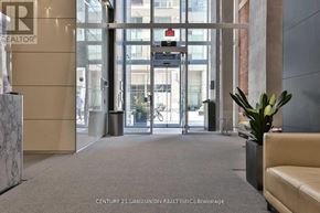 Toronto (Bay Street Corridor) condo for rent - A glass door with a red sign above it.