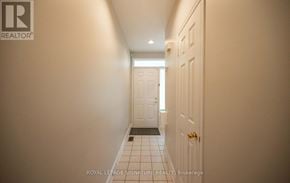 Mississauga (Clarkson) townhouse for rent - A hallway with a door at the end.