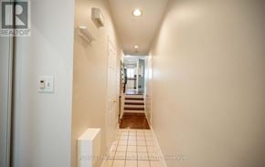 Mississauga (Clarkson) townhouse for rent - A hallway with a staircase leading to the second floor.