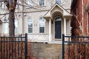 Mississauga (Churchill Meadows) townhouse for rent - A white house with a black door and windows.