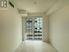 Toronto (Church-Yonge Corridor) condo for rent - A room with a large window and a white wall.