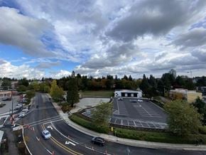 Surrey apartment for rent - A road with a white van driving on it.