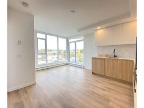 Surrey apartment for rent - A kitchen with a wooden floor and white walls.