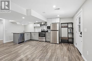 Haldimand apartment for rent - A kitchen with wooden floors and stainless steel appliances.