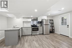 Caledonia apartment for rent - A modern kitchen with stainless steel appliances and wooden flooring.