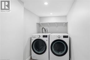 Caledonia apartment for rent - Two front load washing machines in a laundry room.