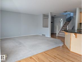 Edmonton apartment for rent - A room with a carpeted floor and a window.