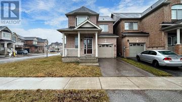 Whitchurch-Stouffville (Stouffville) apartment for rent - A house with a car parked in front of it.