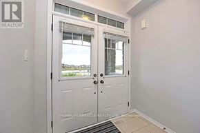 Brampton (Northwest Brampton) apartment for rent - A white door with a glass window is in a room with white walls.