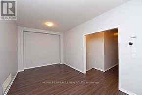 Brampton (Northwest Brampton) apartment for rent - A room with a white door and a brown door.