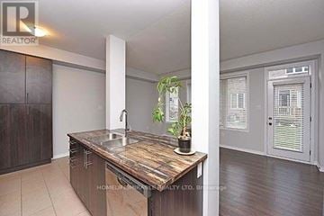 Brampton (Northwest Brampton) apartment for rent - A kitchen with a wooden countertop and a sink.