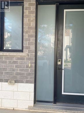 London North (North M) apartment for rent - A glass door with a black frame is closed.