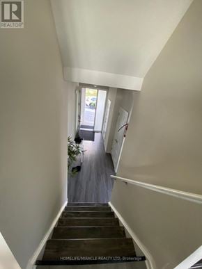 London North (North M) apartment for rent - A staircase leading to a door with a plant on the side.