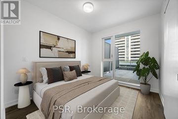 Toronto (Niagara) condo for rent - A bedroom with a large bed and a painting on the wall.