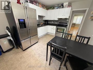 London East (East C) apartment for rent - A kitchen with a black table and chairs.