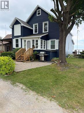 Wainfleet (Lakeshore) apartment for rent - A blue house with a white door and windows.