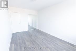 Toronto (St. Andrew-Windfields) condo for rent - A room with a white door and a white wall.