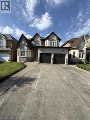 Hamilton apartment for rent - A large, well-maintained house with a driveway in front.