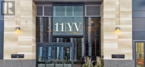 Toronto (Annex) condo for rent - The front of a building with the number 11YV on it.