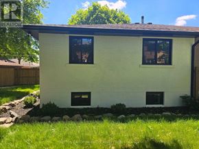 Newmarket (Bristol-London) apartment for rent - A small white house with a black roof and two windows.