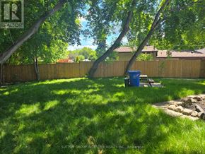 Newmarket (Bristol-London) apartment for rent - A blue trash can sits in a grassy yard.