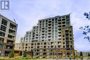 Vaughan (Beverley Glen) condo for rent - A large, modern apartment building with a wooden structure in front of it.