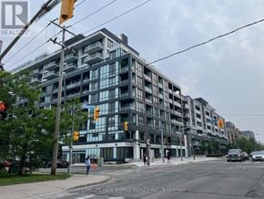 Toronto (Bayview Village) condo for rent - A street view of a multi-story building with the sign "HOMELIFE NEW-WORLD REALTY INC." on the bottom left corner.