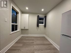 Toronto (Caledonia-Fairbank) apartment for rent - A room with a window and a wooden floor.