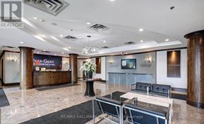 Richmond Hill (Langstaff) condo for rent - A lobby area with a reception desk and a couch.